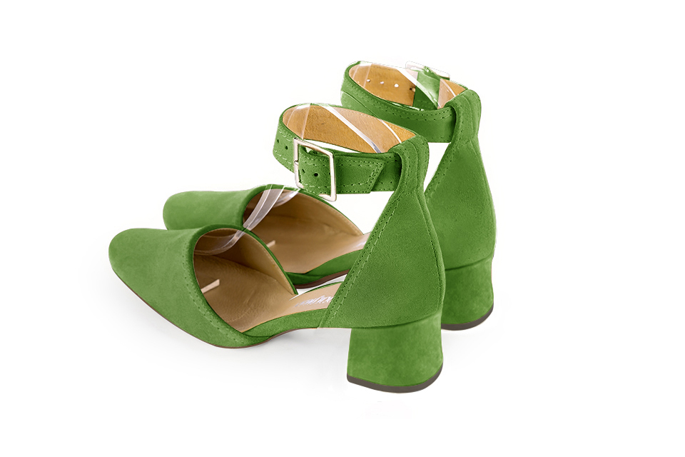 Women's grass green open side dress shoes, with a strap around the ankle. Round toe. Low flare heels - Rear view